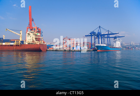 Container barges in urban bay Stock Photo