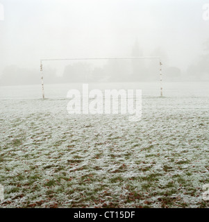 Soccer goal in frosty field Stock Photo