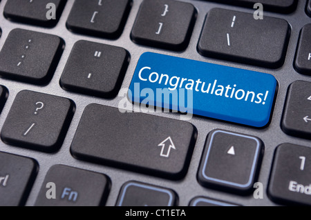 a congratulations message on enter key of keyboard. Stock Photo