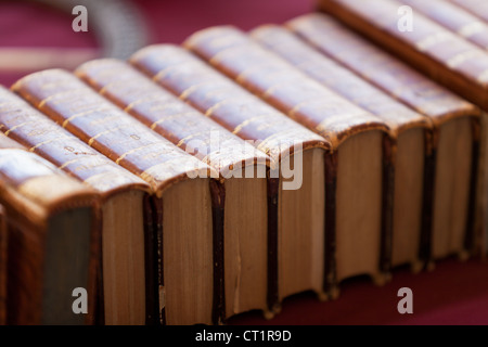 Old books pile from Italian flea market. Horizontal image Stock Photo