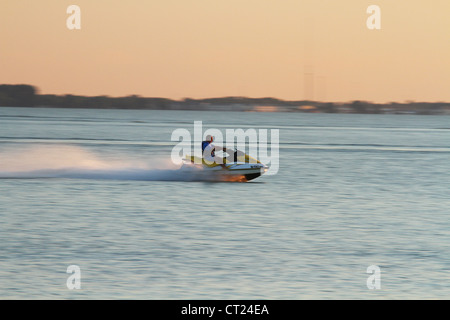 Man on Sea Doo and Lake Erie Sunset. Stock Photo