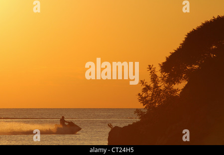 Man on Sea Doo and Lake Erie Sunset. From Catawba Island State Park, Catawba Island, Port Clinton, Ohio, USA. Stock Photo