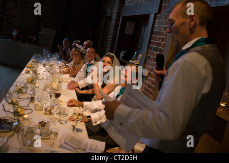 Best man shares memories and tells jokes during reception after a civil wedding ceremony in Essex. Stock Photo