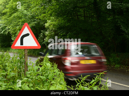 Road sign on approach to a sharp bend Stock Photo - Alamy