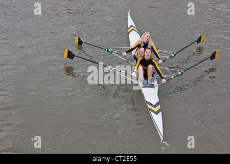 Girl crew pulling in harmony during the annual Head of the River race in Bristol, England Stock Photo
