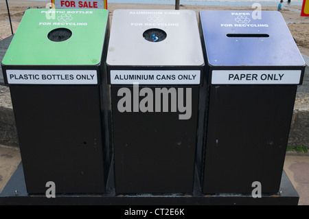 Re-cycling bins on Swanage beach Stock Photo