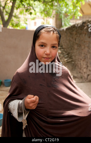 Portrait of a 10 year old arab berber muslim girl in the High Atlas mountains, Morocco Africa Stock Photo