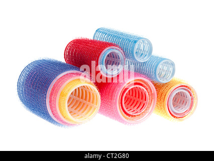 Colorful hair rollers stacked isolated on white background Stock Photo