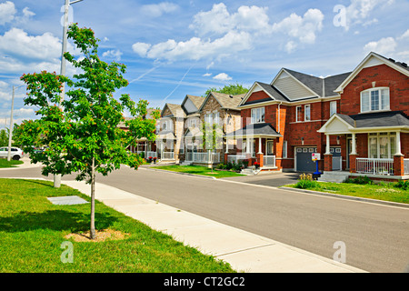 Suburban residential street with red brick houses Stock Photo