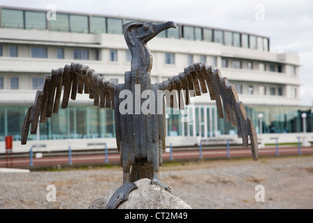 Bird sculpture on promenade at Morecambe with Midland Hotel in background Stock Photo