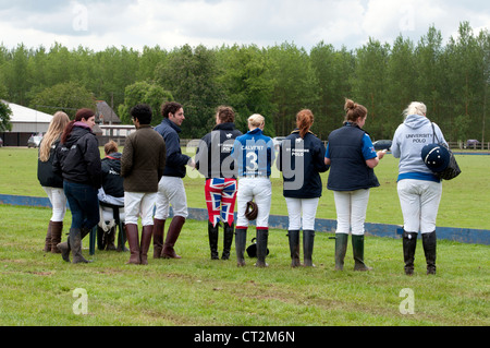 Students watching polo match Stock Photo