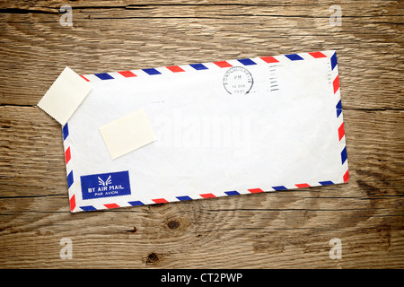 Old envelope on wooden background Stock Photo