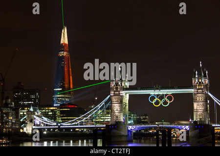 London Tower Bridge with Olympic rings prepared for 2012 Olympic games and inauguration of the Shard building laser show Stock Photo
