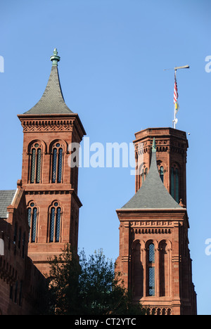 WASHINGTON DC, USA - Smithsonian Castle Towers. Towers on the norther face of the Smithsonian Castle on the National Mall (shot from the east looking west). Originally comprising of exhibit and public engagement space, the Smithsonian Castle is now mostly taken up with the institution's administrative offices. Stock Photo