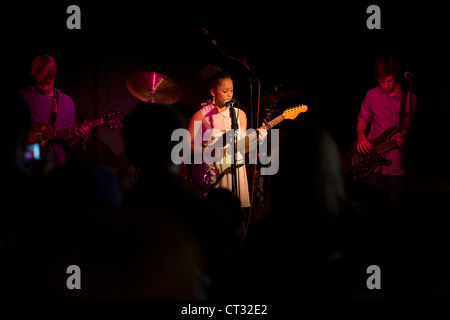 Schoolboys perform rock and roll song together as a band in a south London pub. Stock Photo