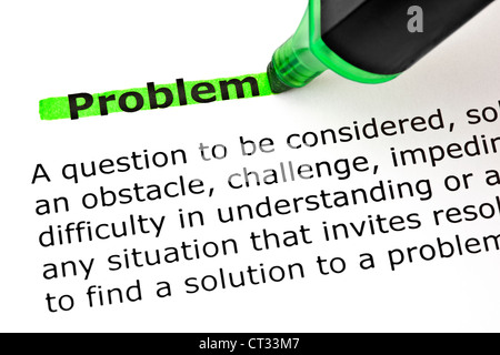 Definition of the word Problem highlighted with green marker on white paper. Stock Photo