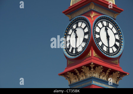 The freshly painted victorian Jubilee clock tower on Weymouth seafront was erected in 1887 to mark fifty years of Queen Victoria’s reign. Dorset, UK. Stock Photo