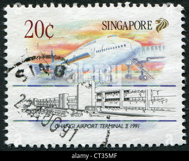SINGAPORE - CIRCA 1991: Postage stamps printed in Singapore, depicts a Boeing 747, Changi Terminal II, circa 1991 Stock Photo