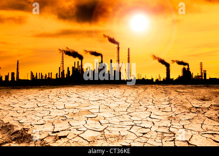 Refinery with smoke and global warming concept Stock Photo