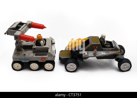 Two Starcom vintage space toys, land vehicles with guns, wheels and drivers. Stock Photo