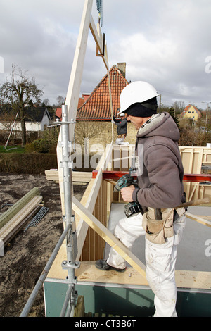 Builder at work on new structure Stock Photo