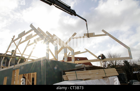 Builder at work on new structure Stock Photo