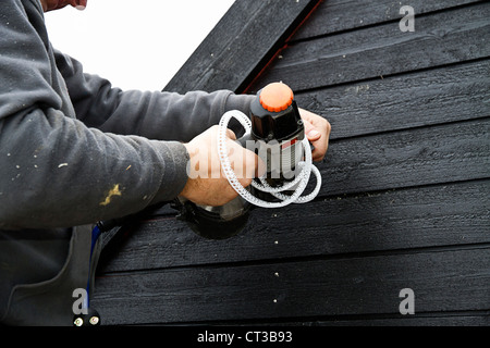 Builder at work on new structure Stock Photo