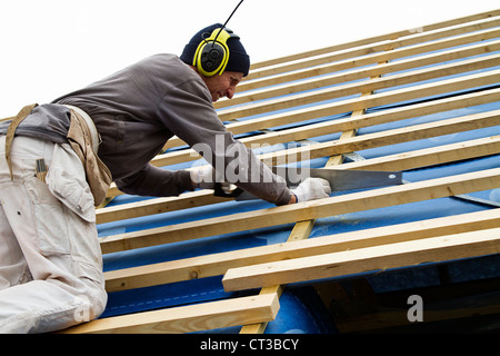 Builder at work on new structure Stock Photo