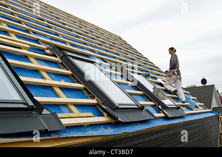 Builder at work on new structure Stock Photo