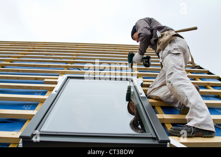 Builder at work on new structure Stock Photo