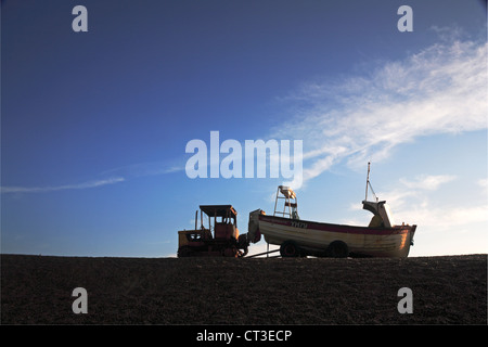 An inshore fishing boat with tractor and trailer on the North Norfolk coast at Weybourne, Norfolk, England, United Kingdom. Stock Photo