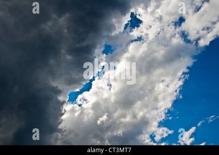 Black clouds and blue sky indicating that a storm is coming Stock Photo