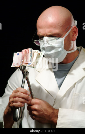 Hamburg, A surgeon holds a pair of pliers with banknotes Stock Photo