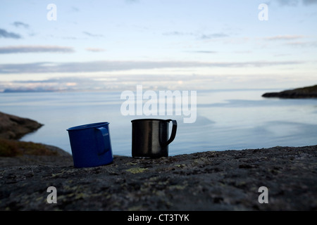 Mugs of tea by the sea Stock Photo