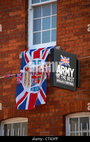 Sign Army be the best regular and territorial with Diamond Jubilee flag hanging from window and Union Jack bunting at Weymouth Stock Photo