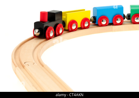 A child's wooden toy train and track - studio shot with a white background Stock Photo