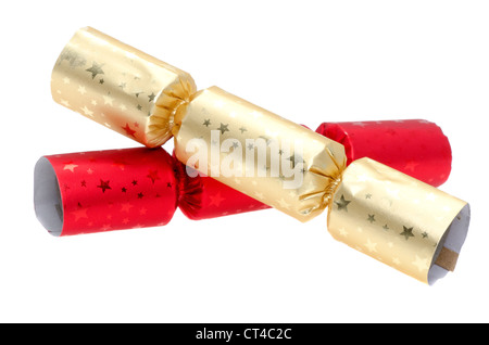 Red and gold Christmas crackers - studio shot with a white background Stock Photo