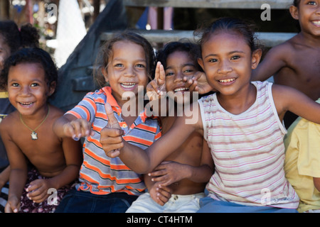 Indonesia, Papua New Guinea, Tubuserea Village. Group of young Motuan children posing in Tubuserea Village. Stock Photo