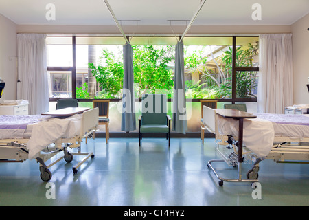 Hospital ward with beds and medical equipment Stock Photo