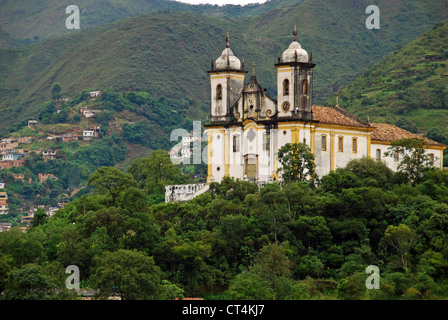 Brazil, Minas Gerais, Ouro Preto, Igreja Sao Francisco de Paula, old colonial church amid vegetation Stock Photo