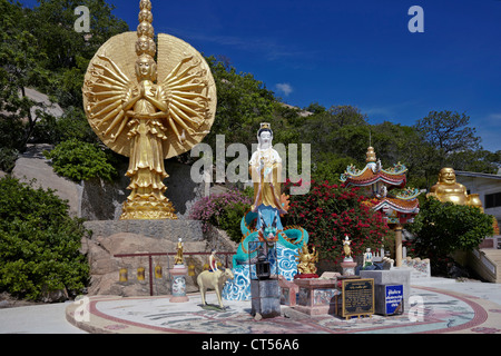 Female deities and ornate golden figures at Khao Takiab Buddhist Chinese temple Hua Hin Thailand S. E. Asia Stock Photo