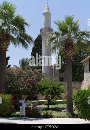 dh Larnaka fort LARNACA CYPRUS Courtyard Grand mosque Buyuk Cami tower Djami Kebir Mosque woman tourism towers holiday maker greece island Stock Photo
