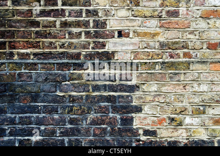 Stained brick wall, grunge background Stock Photo