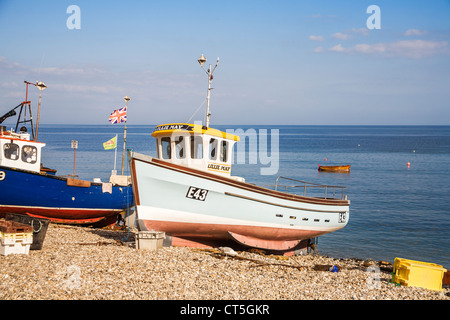 Blue fishing boats on the shingle beach at Sidmouth, Devon, England, UK Stock Photo