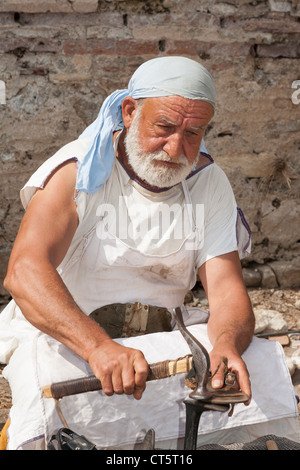 Actor playing the part of a Roman shoemaker, Ephesus, Turkey Stock Photo