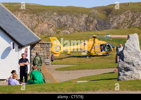 Scottish Air Ambulance Service Helicopter paramedics attending to a woman injured in Durness Sutherland Scotland UK Britain Stock Photo