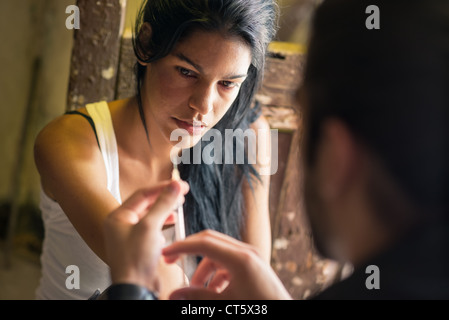 Substance abuse and people, boyfriend and girlfriend shooting up with heroin syringe Stock Photo