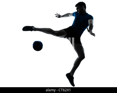 one caucasian man flying kicking playing soccer football player silhouette  in studio isolated on white background Stock Photo