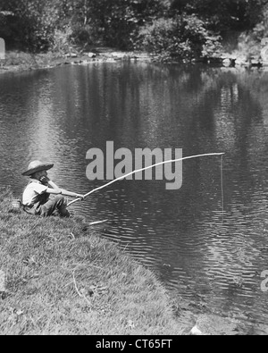 Boy fishing hat Black and White Stock Photos & Images - Alamy