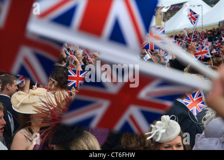 Rule Britannia and Land of Hope and Glory, patriotic English songs being sung, waving Union Jack Flags at the end of the days at the band stand. Royal Ascot 2016 2010 UK HOMER SYKES Stock Photo